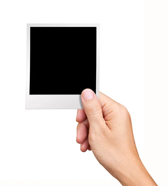 el boş Instant photo beyaz arka plan üzerinde tutarak