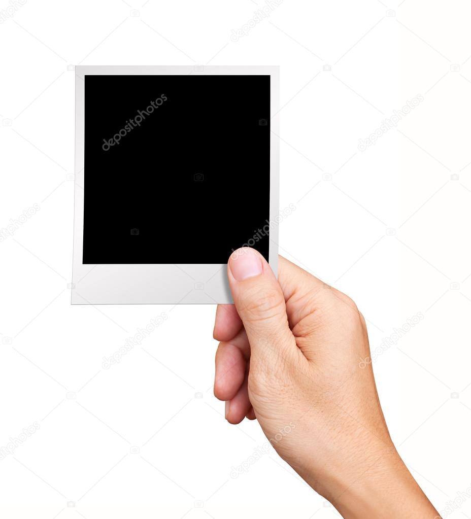 Hand holding blank Instant Photo on white background