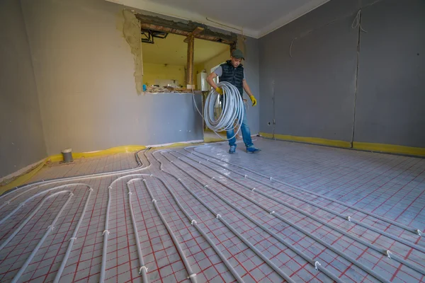 Pipefitter Installing System Warm Floor — Stock Photo, Image