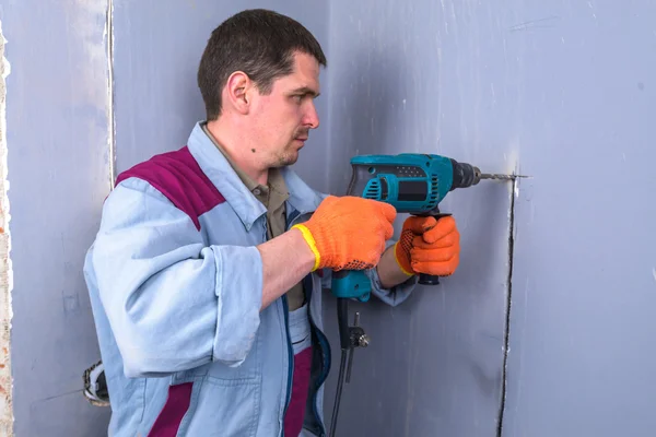 Worker Holding Electric Drill Drilling Wall House — Stock Photo, Image