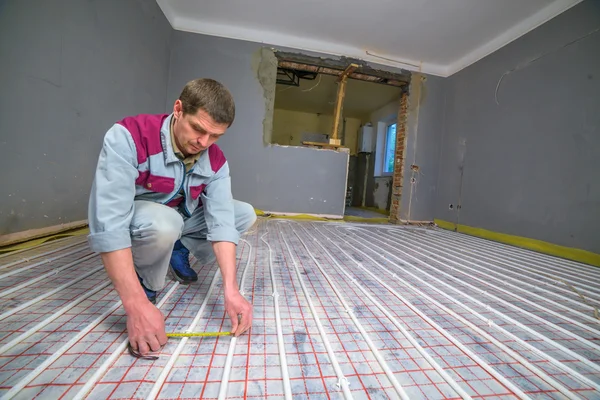 Pipefitter Installing System Warm Floor — Stock Photo, Image