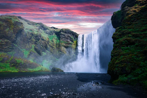 Famous Skogafoss waterfall on Skoga river in sunrise time
