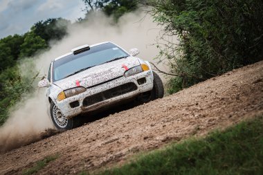 Rally car on dirt track clipart