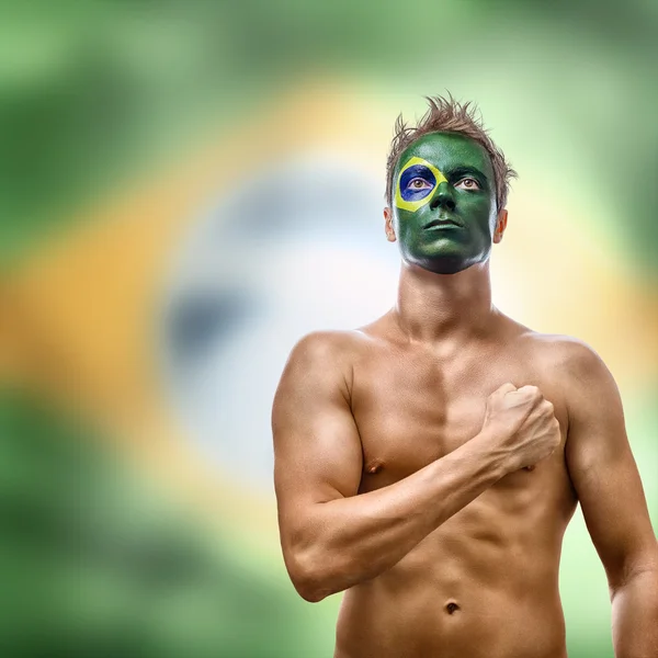 Hombre con bandera brasileña pintado en la cara —  Fotos de Stock