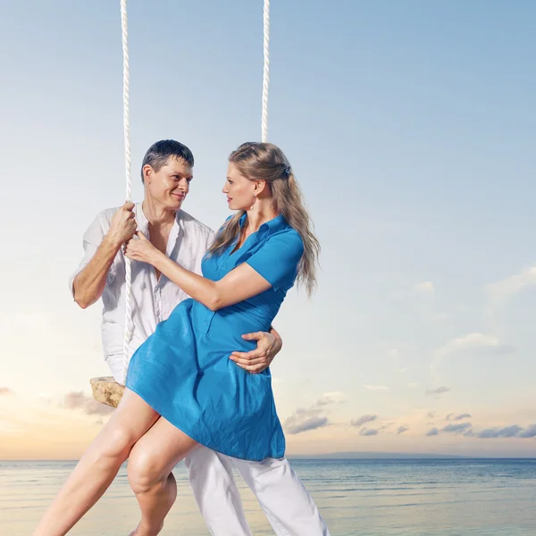 Couple enjoying swing — Stock Photo, Image