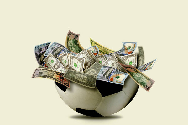 A cracked soccer ball overflowing with US dollar bills, symbolizing the financial power, commercialization, and high-stakes nature of modern football.