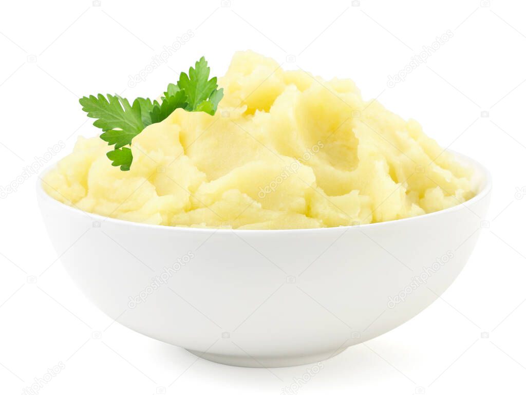 Mashed potatoes with a parsley leaf in a plate close-up on a white background. Isolated