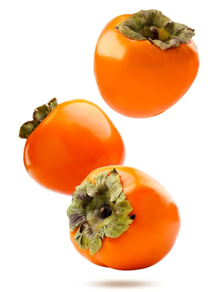 Three Ripe Persimmons Falling White Background Isolated — Stock Photo, Image