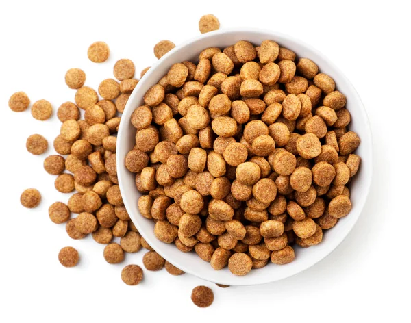 Dry pet food in a plate on a white background, isolated. Top view — Stock Photo, Image