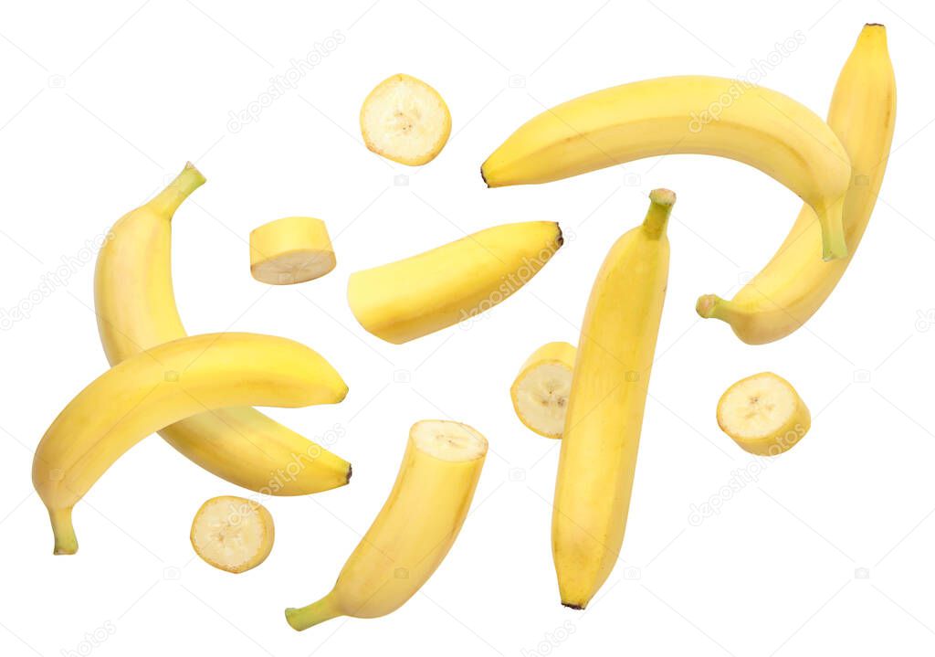 Whole bananas and slices are flying close-up on a white background. Isolated