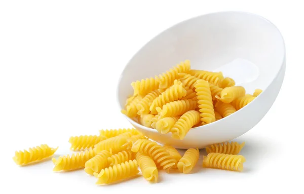 Uncooked Spiral Pasta Plate Close White Background Spilled Out Isolated — Stock Photo, Image