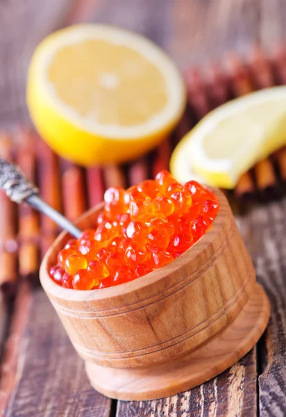 Salmon caviar and lemon — Stock Photo, Image