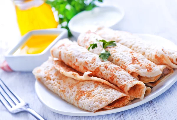 Pancakes with meat on the plate — Stock Photo, Image