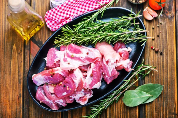 Raw meat on plate — Stock Photo, Image