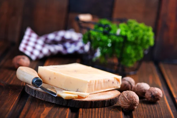 Cheese on wooden board — Stock Photo, Image