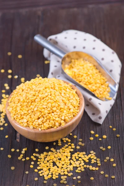 Yellow lentil in bowl — Stock Photo, Image