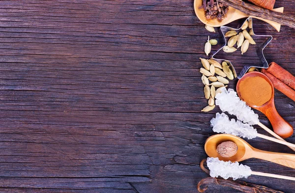 Spices for baking on wooden table — Stock Photo, Image