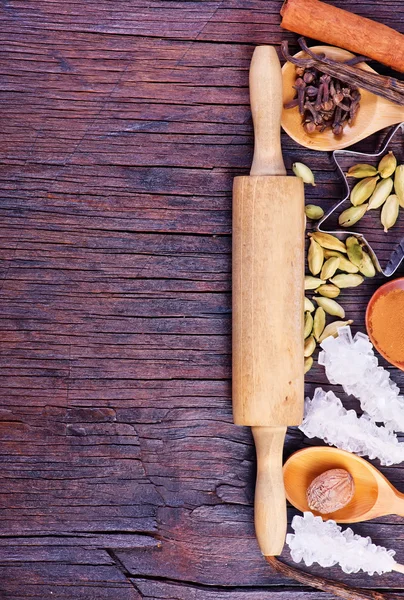 Spices for baking on wooden table — Stock Photo, Image