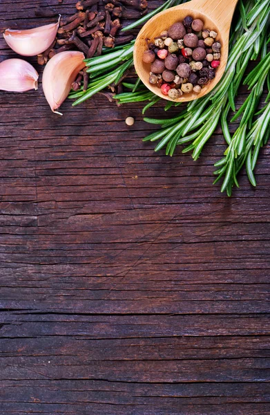 Mix pepper with fresh rosemary — Stock Photo, Image