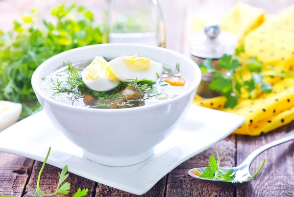 Green soup with boiled egg — Stock Photo, Image