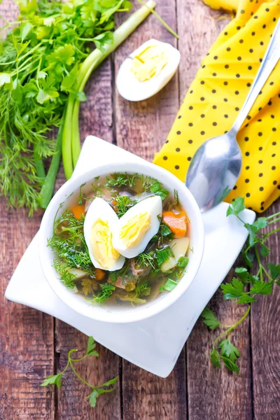 Green soup with boiled egg — Stock Photo, Image