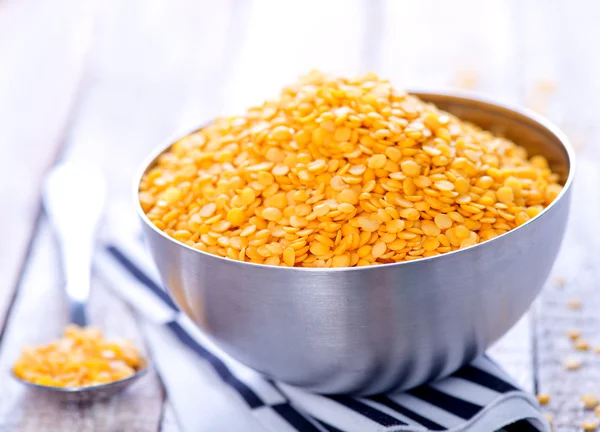 Raw lentil in metal bowl — Stock Photo, Image