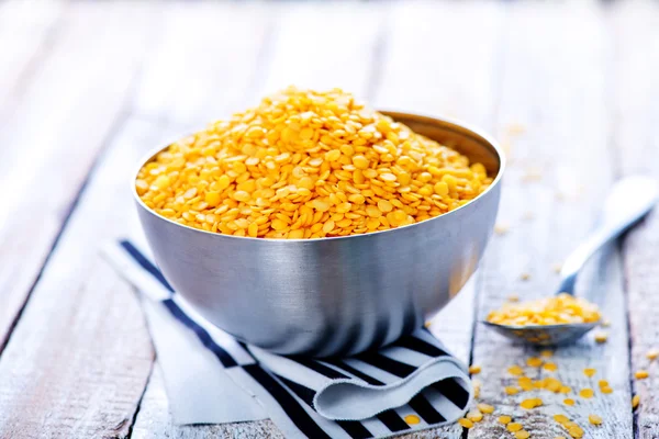 Raw lentil in metal bowl — Stock Photo, Image