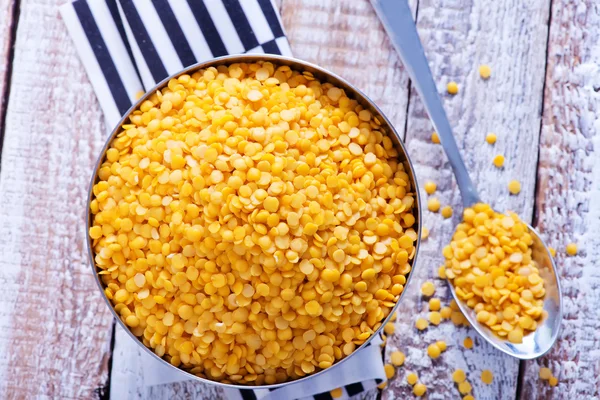 Raw lentil in metal bowl — Stock Photo, Image