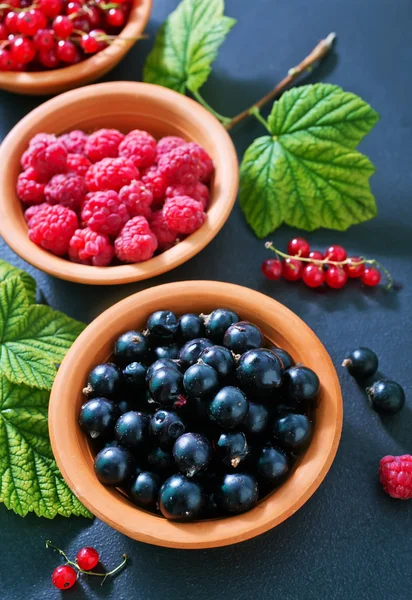 Tasty berries in bowls — Stock Photo, Image