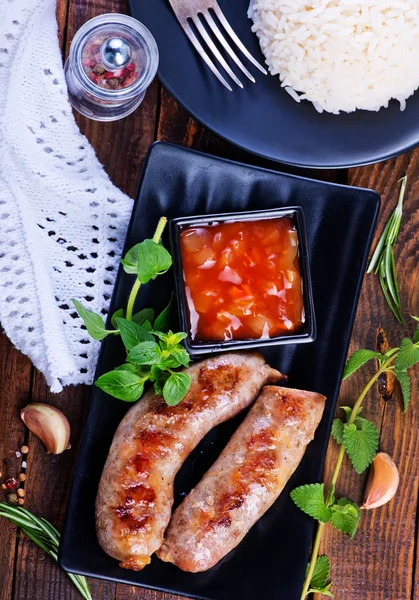 Boiled rice with sausages — Stock Photo, Image