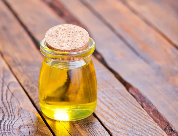 Oil in glass bottle — Stock Photo, Image