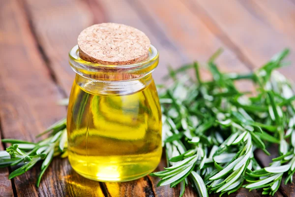 Rosemary oil in bottle — Stock Photo, Image