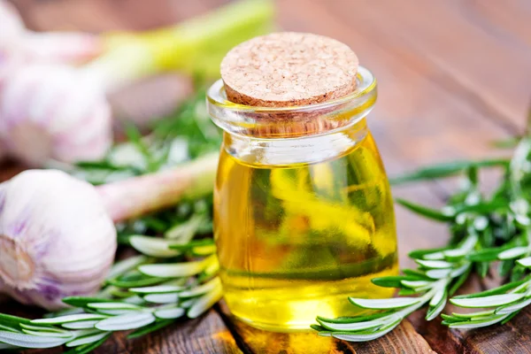 Rosemary oil with garlic — Stock Photo, Image