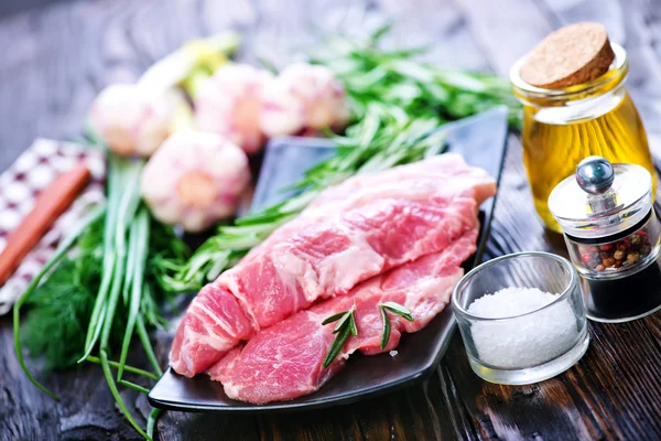 Raw meat with spices — Stock Photo, Image