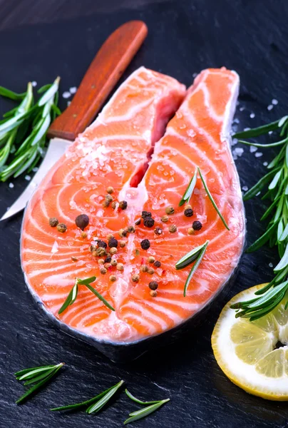 Fresh salmon with rosemary — Stock Photo, Image