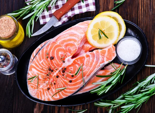 Fresh salmon with rosemary — Stock Photo, Image