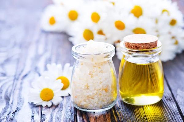 Chamomille salt and oil in bottles — Stock Photo, Image