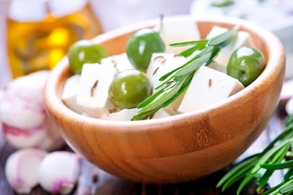Feta cheese with rosemary and olives — Stock Photo, Image