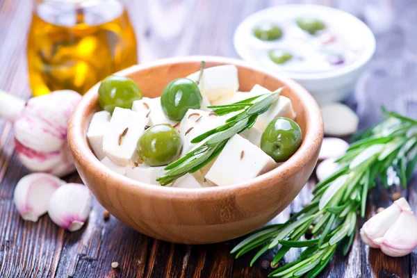 Feta cheese with rosemary and olives — Stock Photo, Image