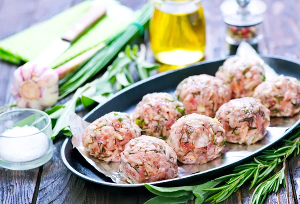 Raw meat balls on plate — Stock Photo, Image