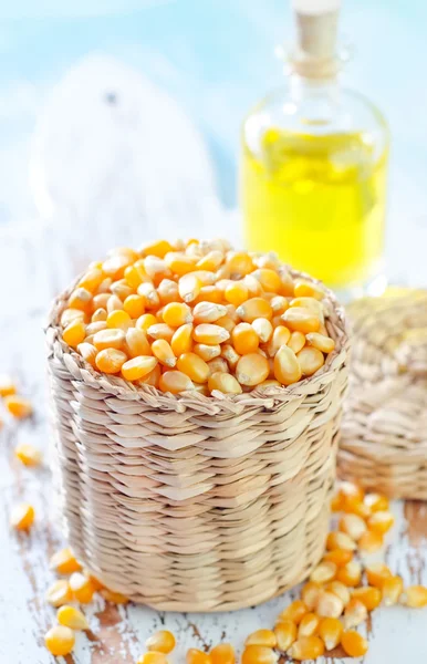 Dried corn and oil — Stock Photo, Image