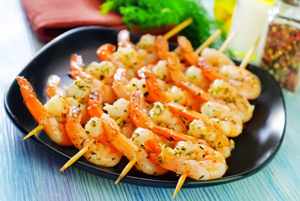 Boiled shrimps on sticks — Stock Photo, Image