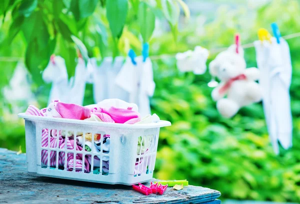 Baby clothes on rope — Stock Photo, Image