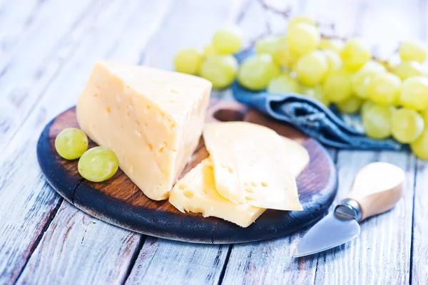 Delicious cheese with grapes — Stock Photo, Image