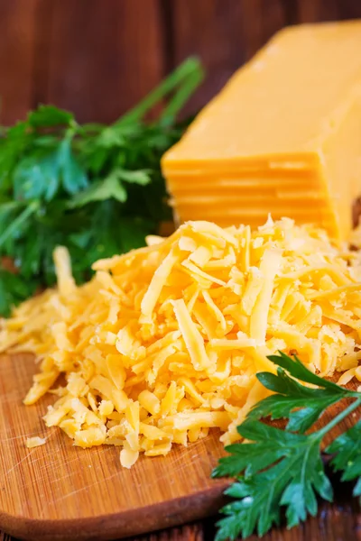 Sliced cheddar cheese — Stock Photo, Image