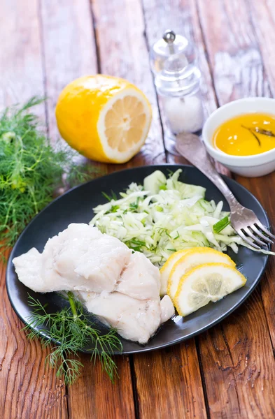 boiled fish with lemon