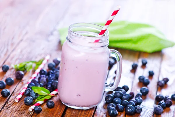 Glass of yogurt with berries — Stock Photo, Image