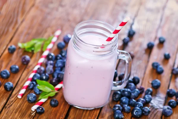Glass of yogurt with berries — Stock Photo, Image