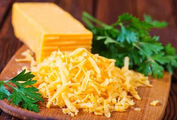 Sliced cheddar cheese — Stock Photo, Image