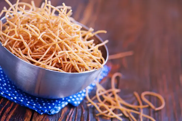 Brown pasta in bowl — Stock Photo, Image